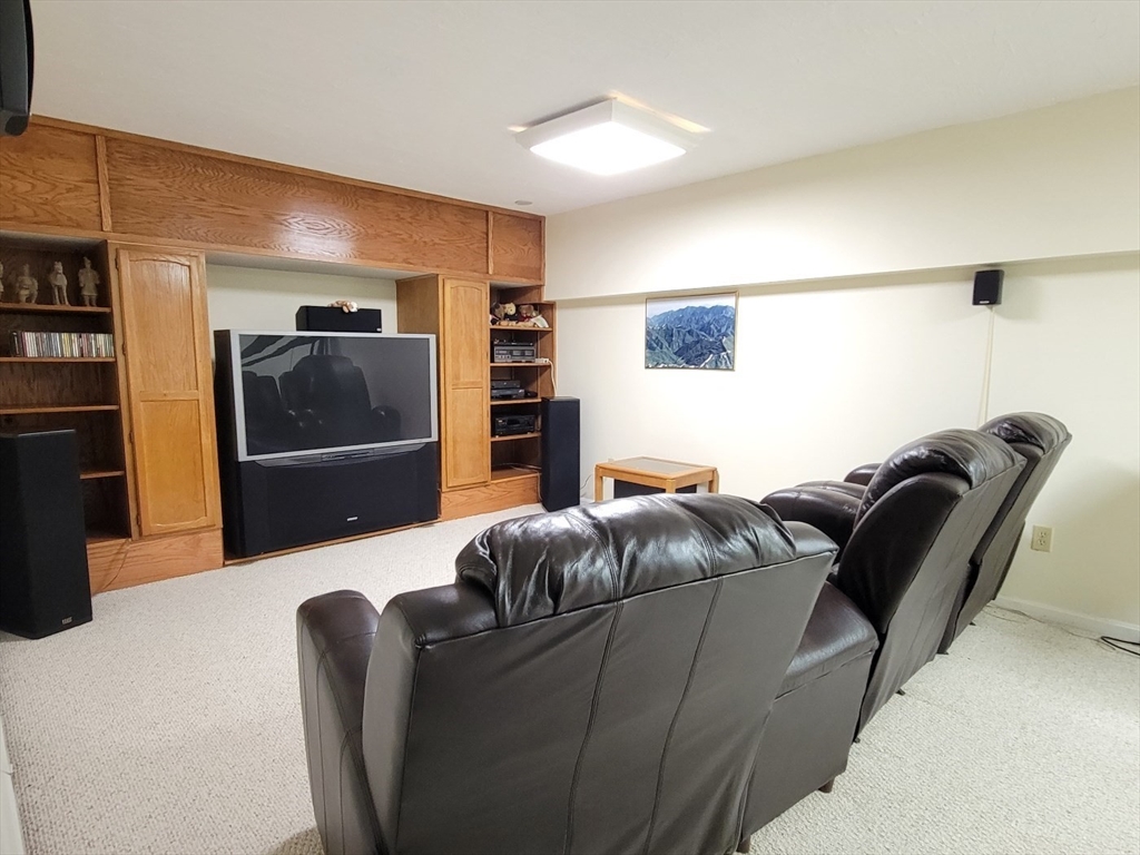11 Femia Road Ashland, MA 01721 - Photo 34 of 42 a living room with furniture and a flat screen tv
