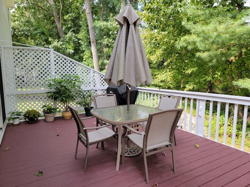 11 Femia Road Ashland, MA 01721 - Photo 35 of 42 a view of a deck with a table and chairs