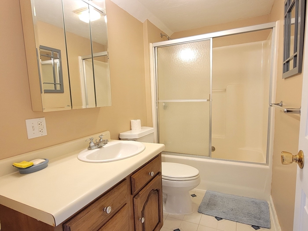 11 Femia Road Ashland, MA 01721 - Photo 41 of 42 a bathroom with a sink a toilet and shower