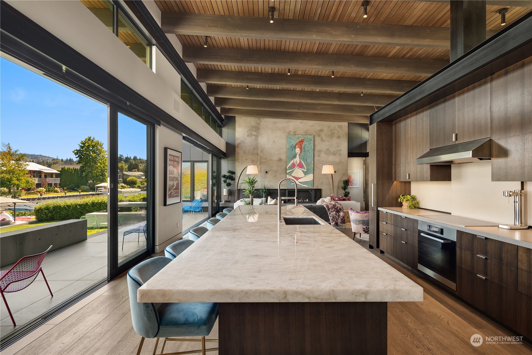 85 Cascade Key Bellevue, WA 98006 - Photo 11 of 37 a large kitchen with stainless steel appliances granite countertop center island wooden floor wooden cabinets and stainless steel appliances