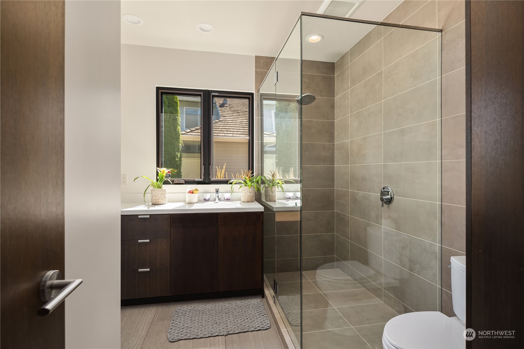 85 Cascade Key Bellevue, WA 98006 - Photo 21 of 37 a bathroom with a sink mirror and shower