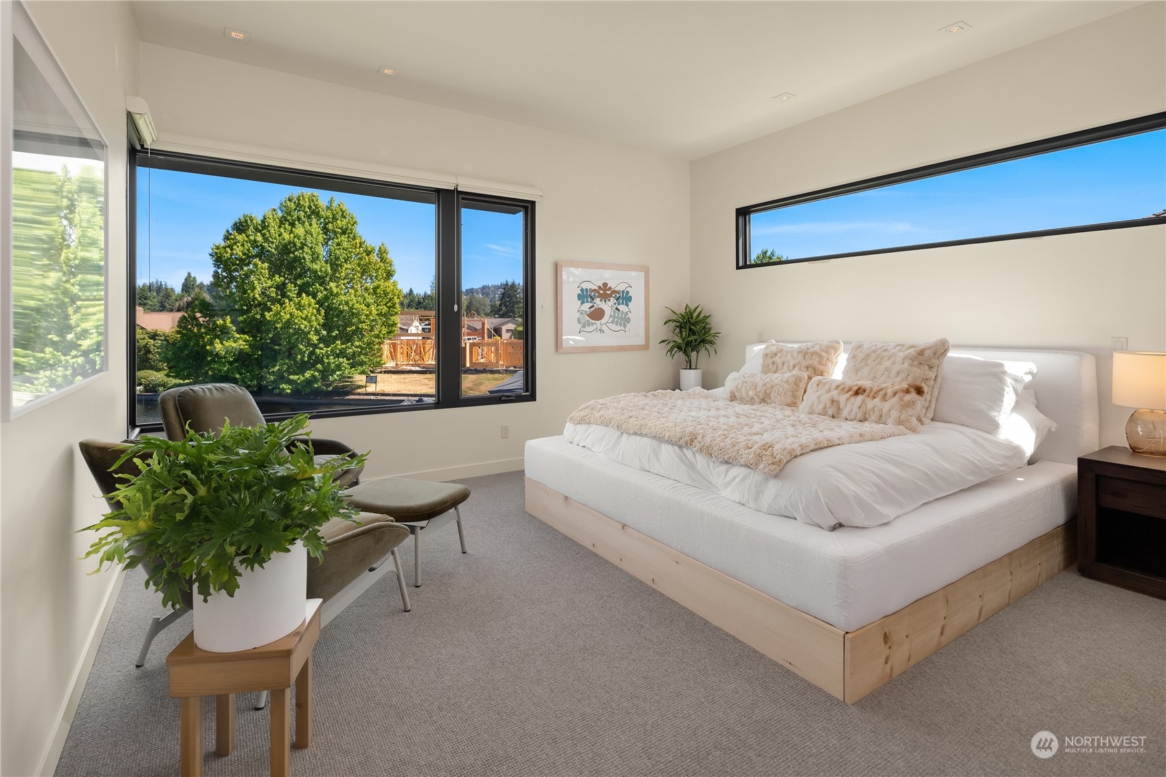 85 Cascade Key Bellevue, WA 98006 - Photo 26 of 37 a bedroom with a large bed and a potted plant