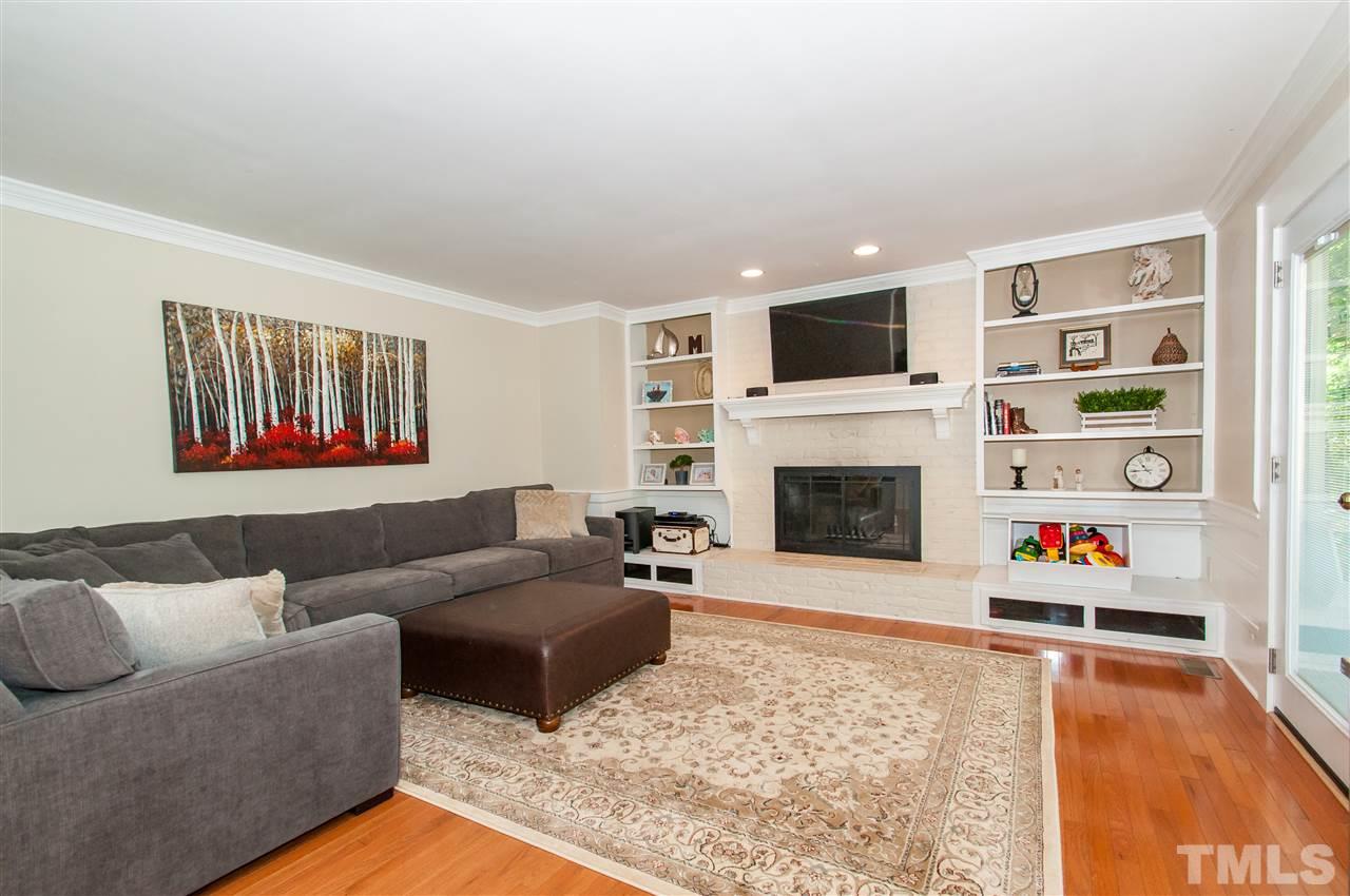 11905 Deer Run Raleigh, NC 27614 - Photo 3 of 25 a living room with furniture fireplace and flat screen tv