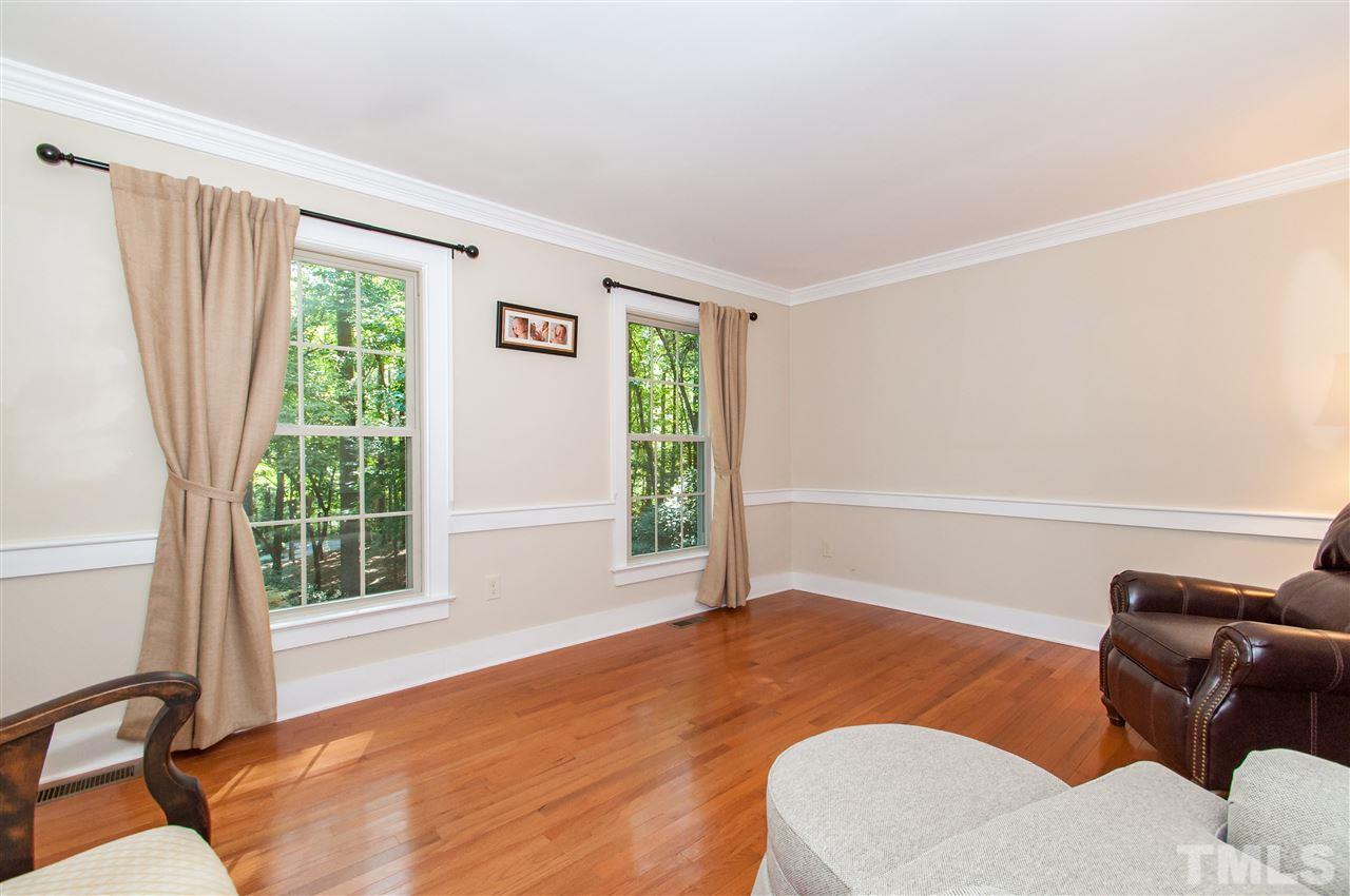 11905 Deer Run Raleigh, NC 27614 - Photo 6 of 25 a bedroom with a bed and a window