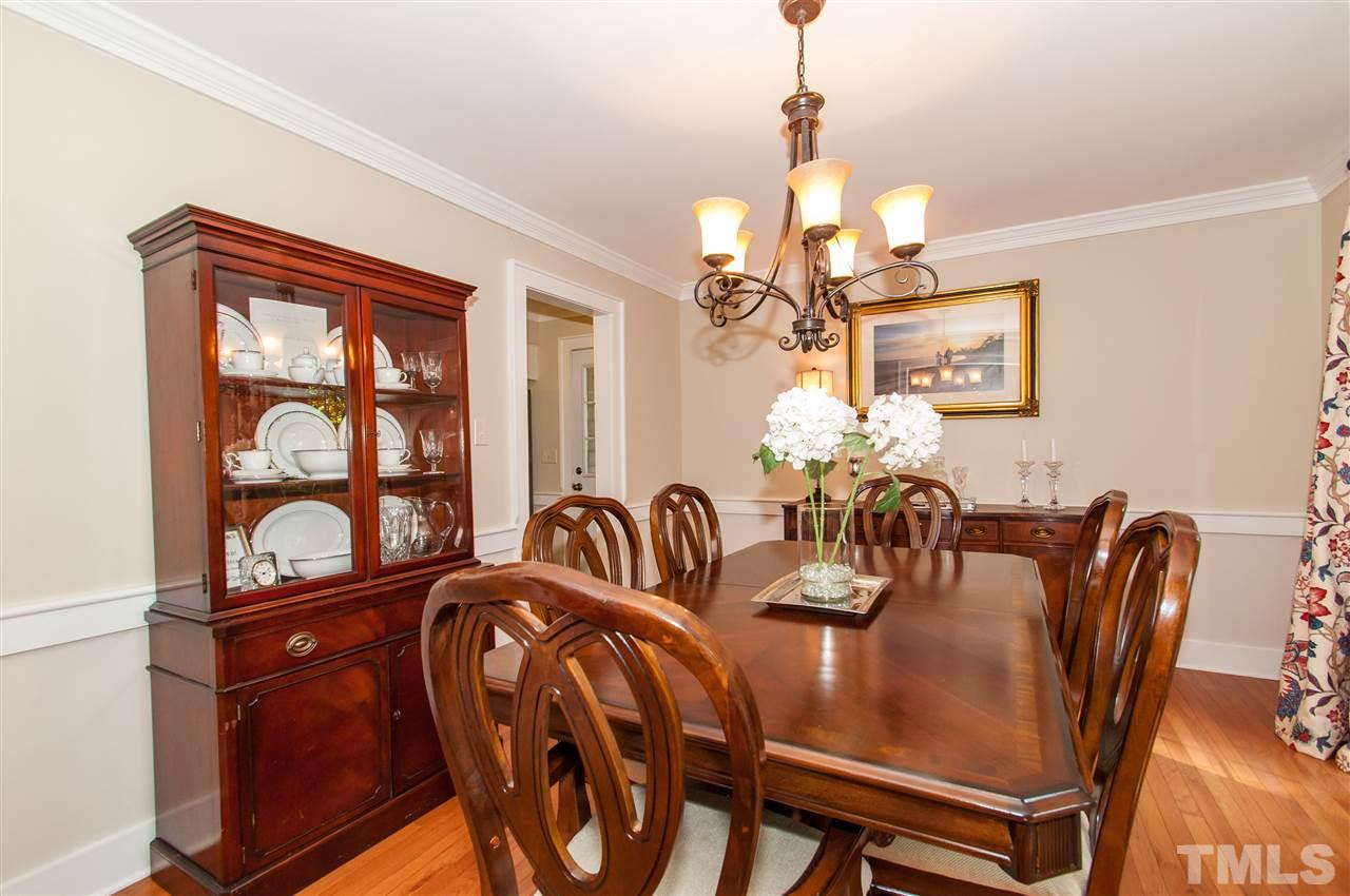 11905 Deer Run Raleigh, NC 27614 - Photo 8 of 25 a dining room with furniture a chandelier and window