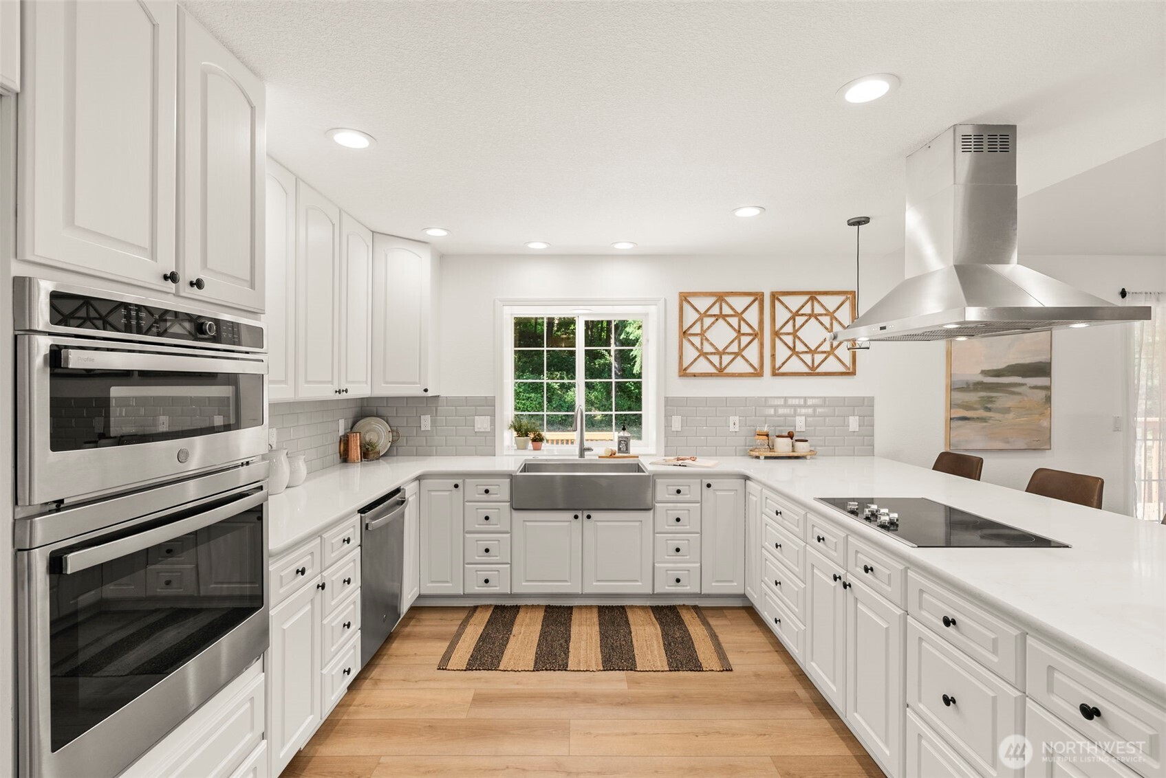 12225 Case Road Southwest Olympia, WA 98512 - Photo 16 of 40 a kitchen with granite countertop a sink stainless steel appliances and cabinets