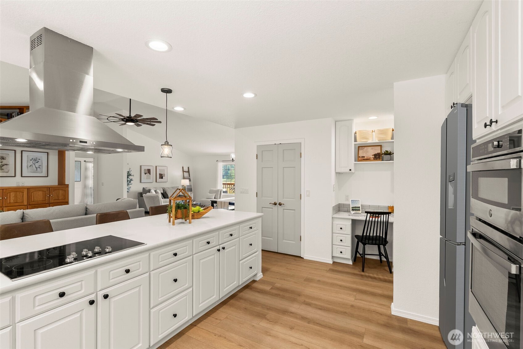 12225 Case Road Southwest Olympia, WA 98512 - Photo 18 of 40 a large white kitchen with cabinets