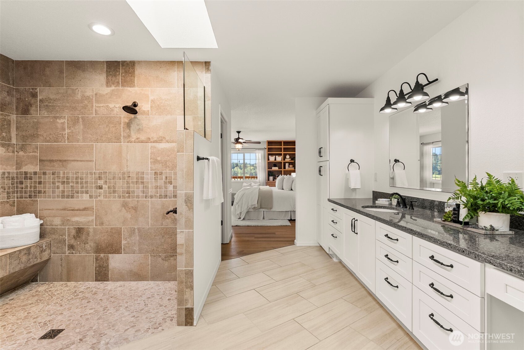 12225 Case Road Southwest Olympia, WA 98512 - Photo 22 of 40 a spacious bathroom with a granite countertop sink a mirror and shower