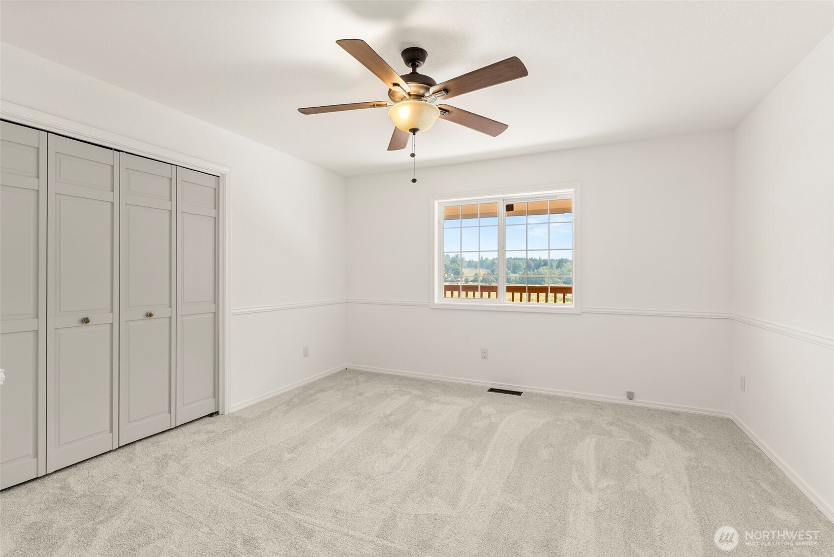 12225 Case Road Southwest Olympia, WA 98512 - Photo 26 of 40 wooden floor in an empty room with a window