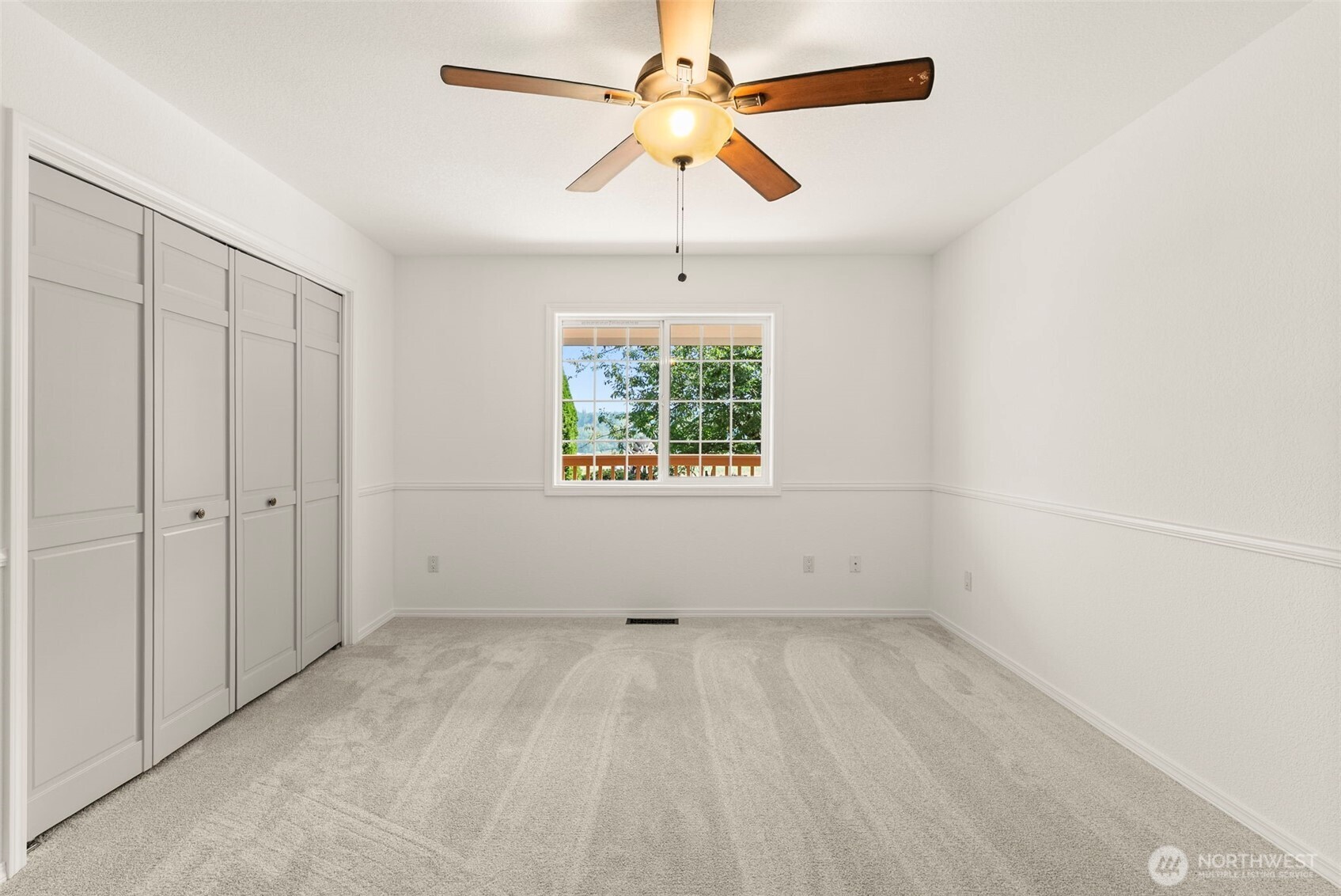 12225 Case Road Southwest Olympia, WA 98512 - Photo 27 of 40 an empty room with windows and fan