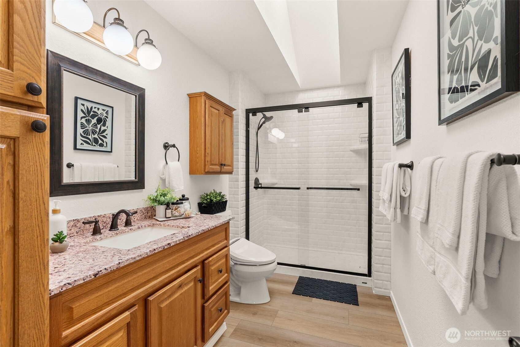 12225 Case Road Southwest Olympia, WA 98512 - Photo 28 of 40 a spacious bathroom with a granite countertop sink mirror vanity and toilet