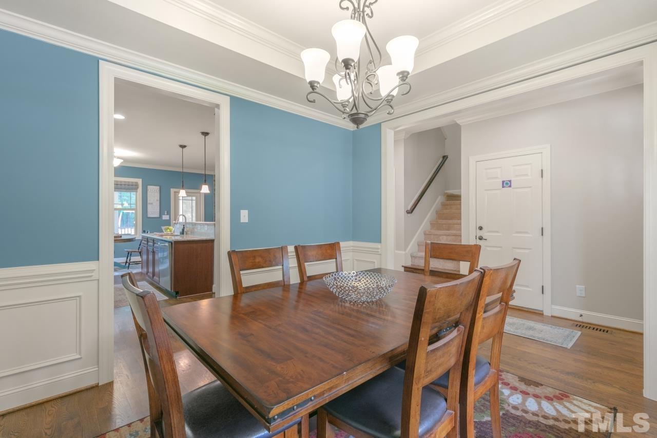 558 Fontana Drive Clayton, NC 27527 - Photo 12 of 41 a view of a dining room with furniture and wooden floor