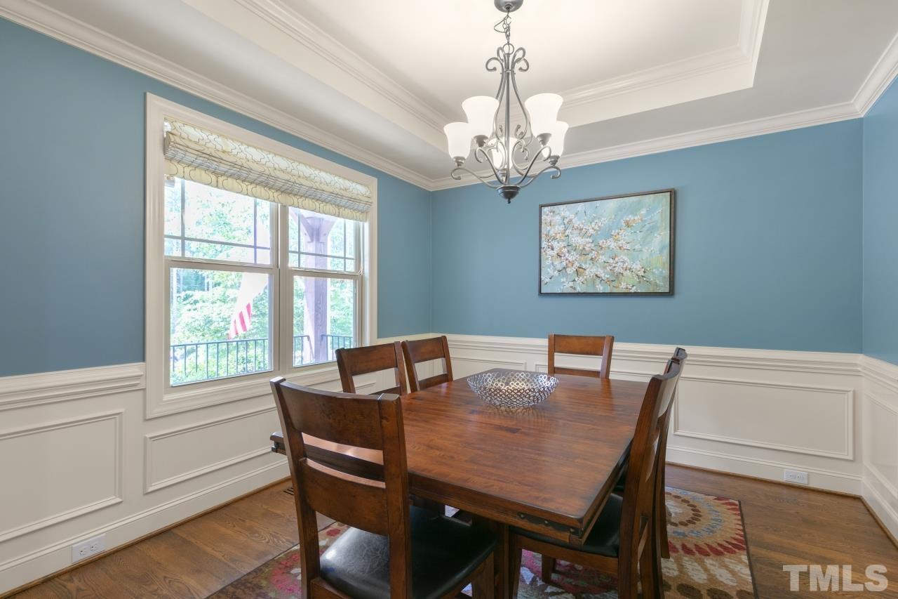 558 Fontana Drive Clayton, NC 27527 - Photo 13 of 41 a view of a dining room with furniture window and wooden floor