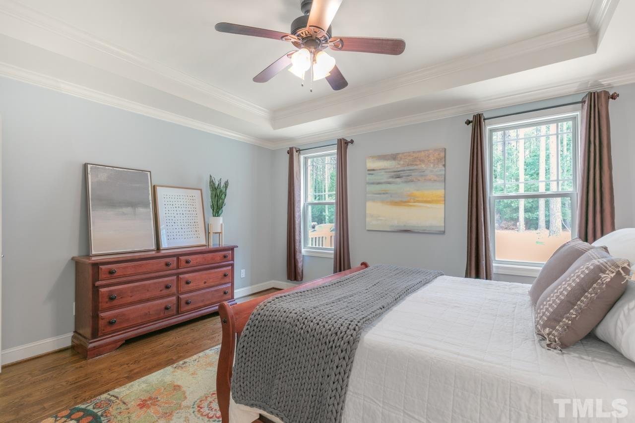 558 Fontana Drive Clayton, NC 27527 - Photo 16 of 41 a bedroom with a bed dresser and a window