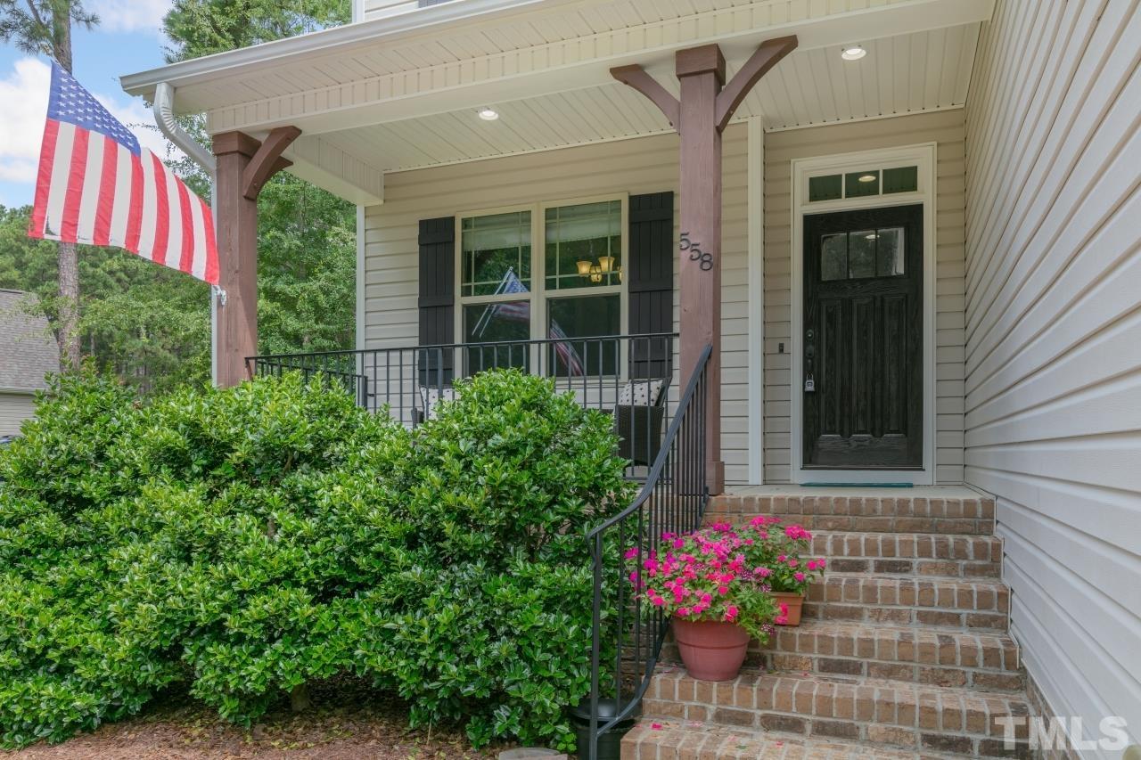 558 Fontana Drive Clayton, NC 27527 - Photo 2 of 41 a view of a house with potted plants