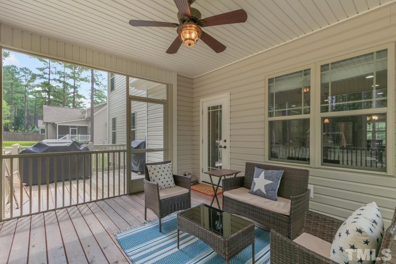 558 Fontana Drive Clayton, NC 27527 - Photo 35 of 41 a balcony with furniture and wooden floor