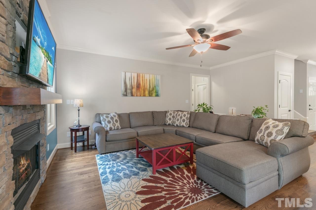 558 Fontana Drive Clayton, NC 27527 - Photo 10 of 41 a living room with furniture and a fireplace