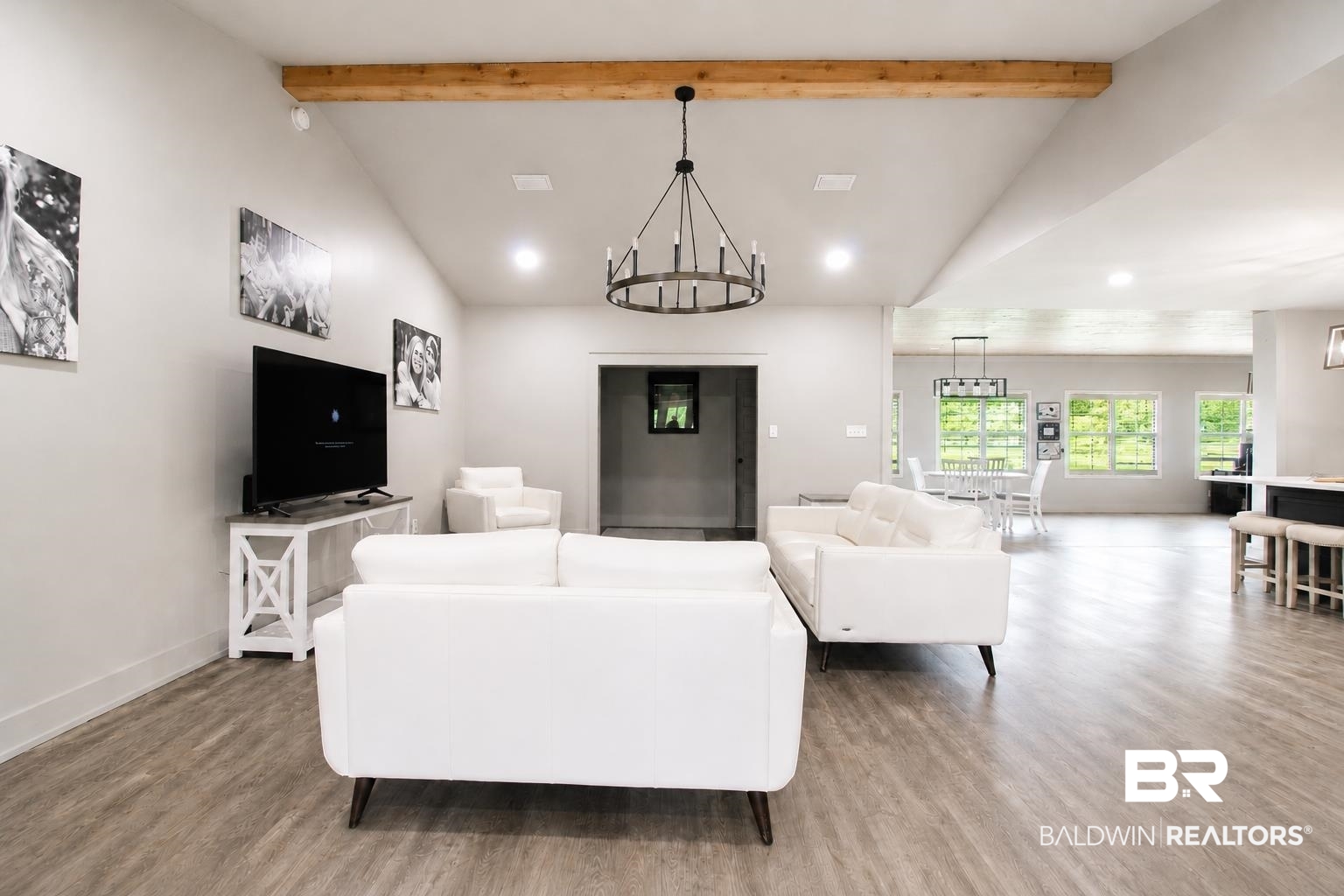 9825 Wolf Creek Ridge Elberta, AL 36530 - Photo 40 of 76 Spacious interior with wood-finish flooring, vaulted ceilings, and exposed wood beam