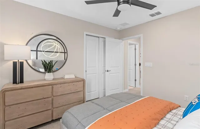 a bedroom with a bed and a dresser