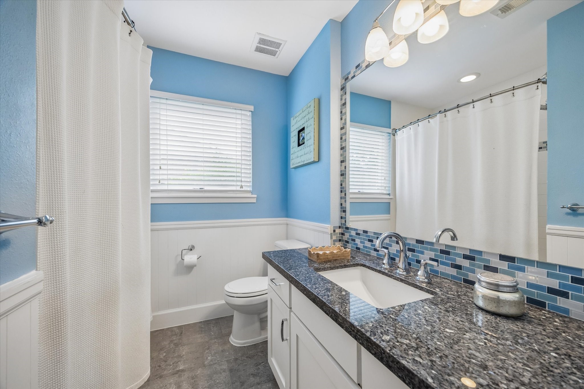 1018 Ben Hur Drive Spring Valley Village, TX 77055 - Photo 21 of 30 Hall bathroom with shower/tub combo, ample storage and granite countertops.