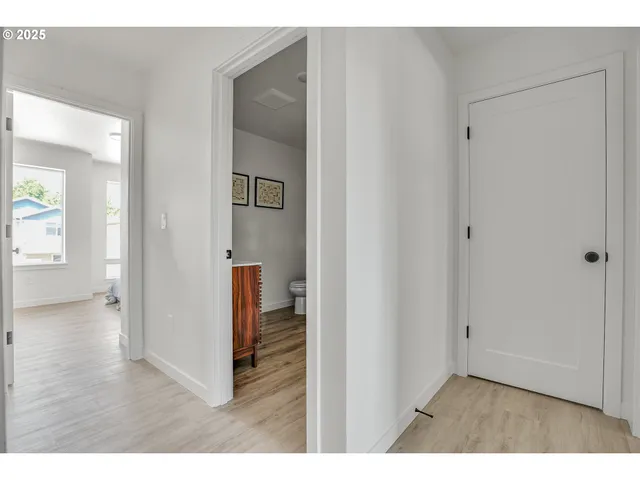 a view of a dining room with furniture and windows