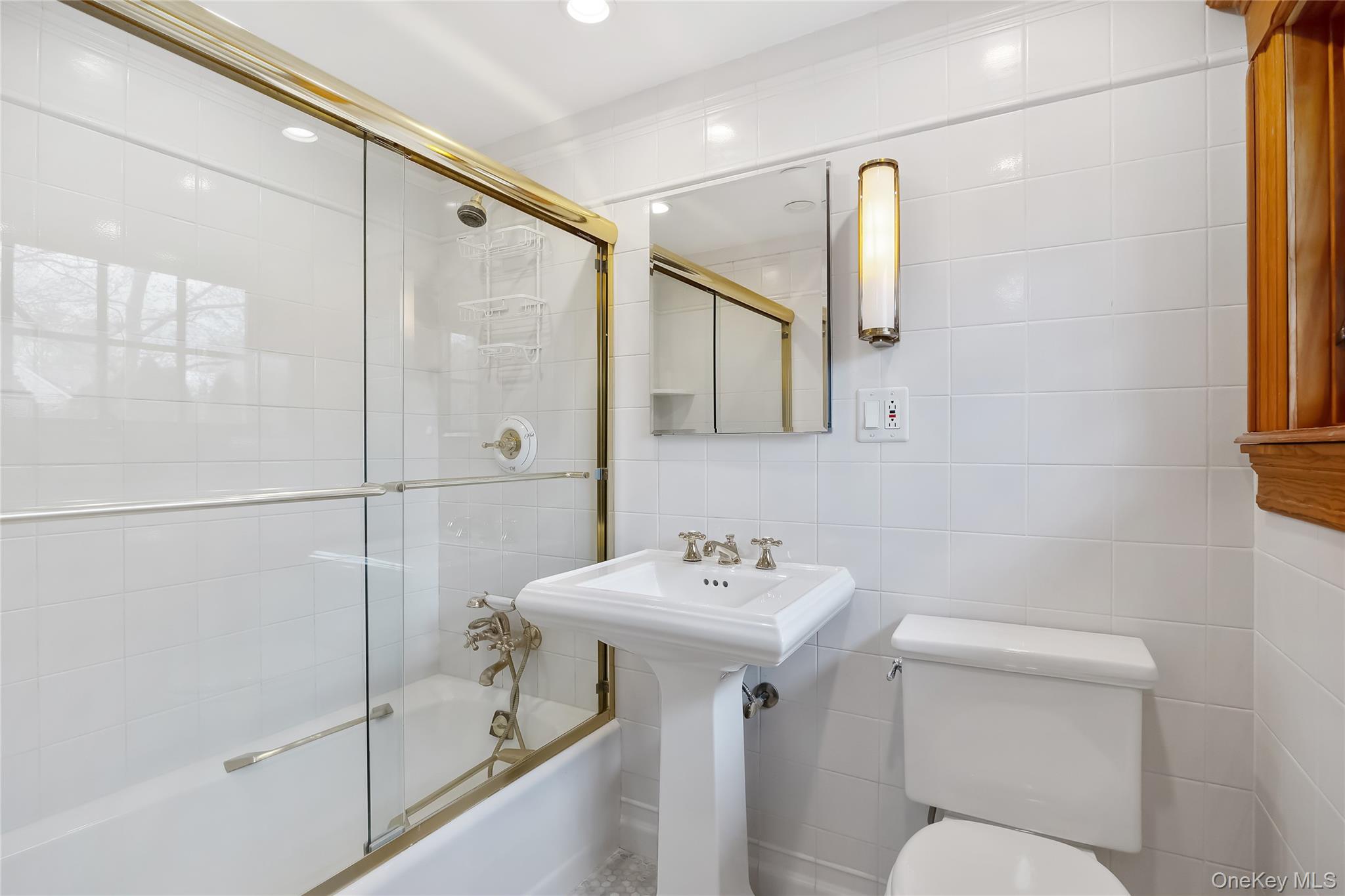 1-27 Beverly Road Queens, NY 11363 - Photo 45 of 46 a bathroom with a sink toilet and shower