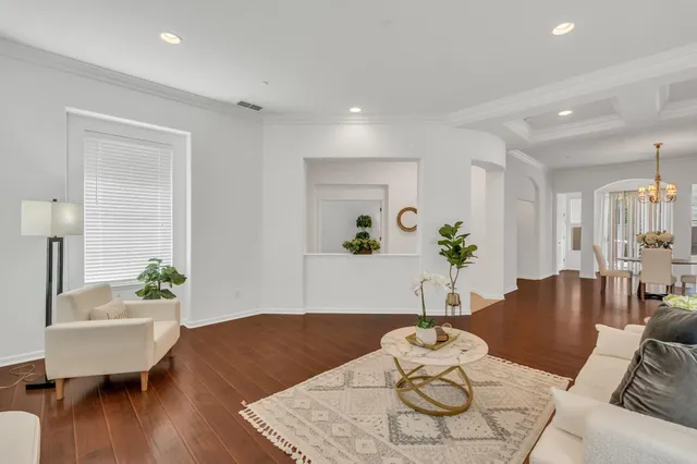 a kitchen with kitchen island granite countertop a sink appliances and cabinets
