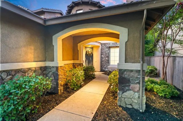 a view of a dining room with furniture wooden floor and chandelier