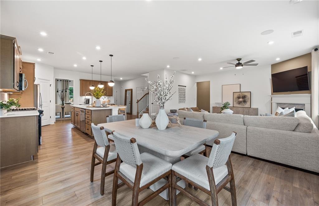 808 Tupelo Way Villa Rica, GA 30180 - Photo 19 of 48 a view of a dining room with furniture and wooden floor