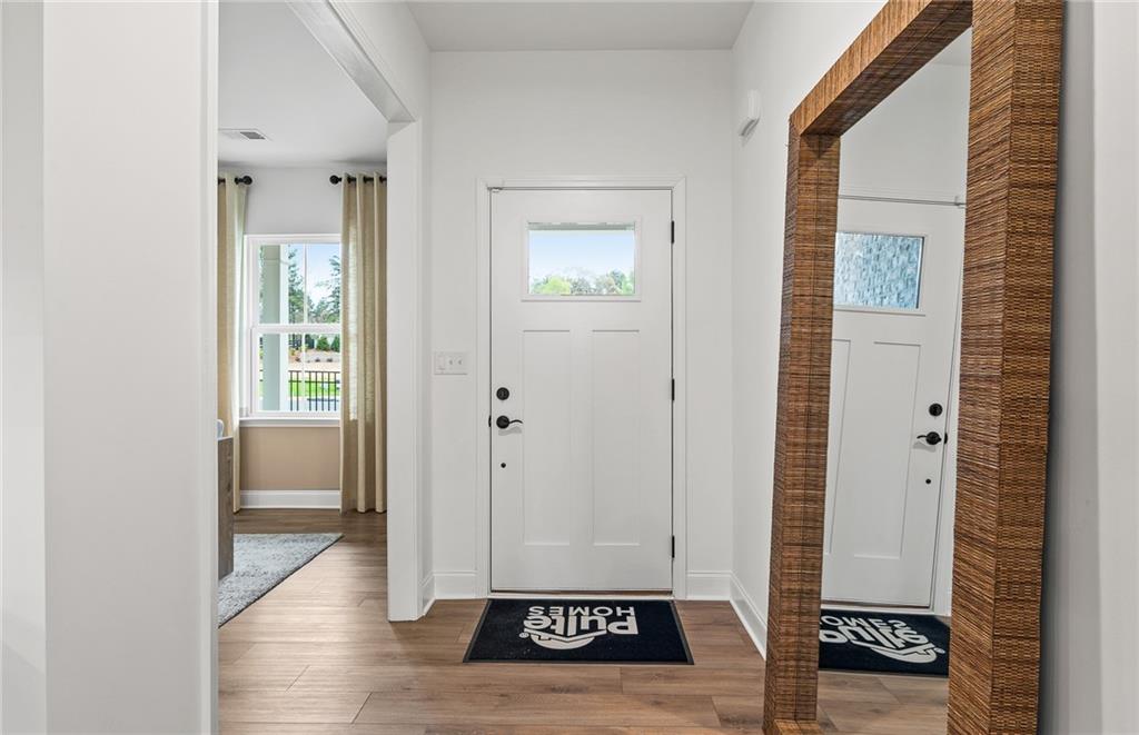 808 Tupelo Way Villa Rica, GA 30180 - Photo 3 of 48 a view of front door with wooden floor