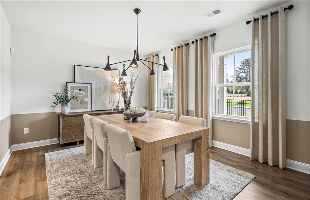 808 Tupelo Way Villa Rica, GA 30180 - Photo 4 of 48 a kitchen with stainless steel appliances granite countertop a sink a refrigerator and a wooden floor