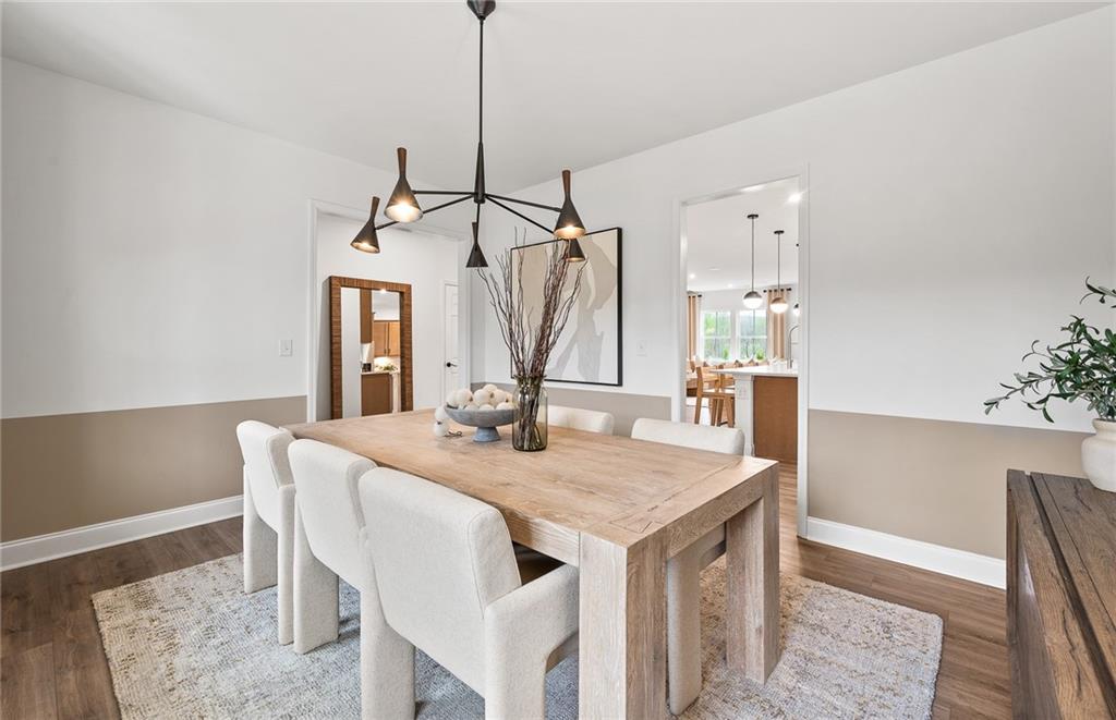 808 Tupelo Way Villa Rica, GA 30180 - Photo 6 of 48 a view of a dining room with a table and chairs