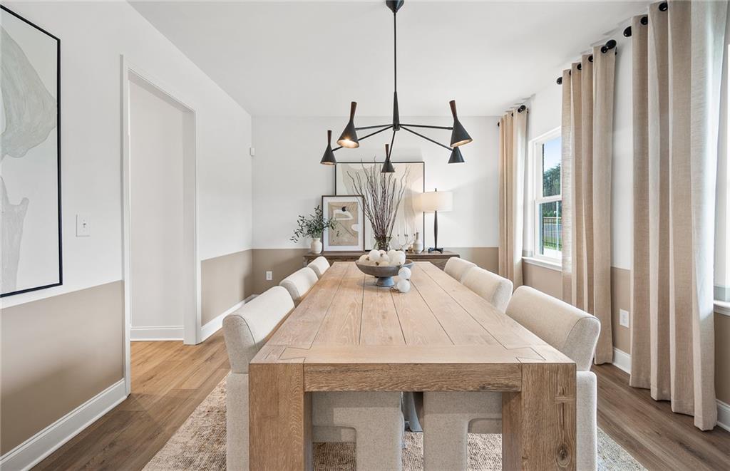 808 Tupelo Way Villa Rica, GA 30180 - Photo 8 of 48 a view of a dining table chairs and chandelier