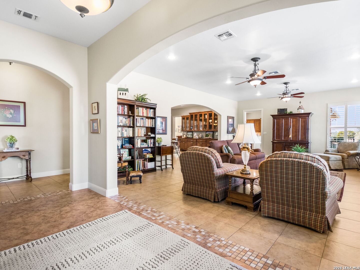 1000 Landmark Kerrville, TX 78028 - Photo 11 of 71 a living room with furniture a piano and a bookshelf