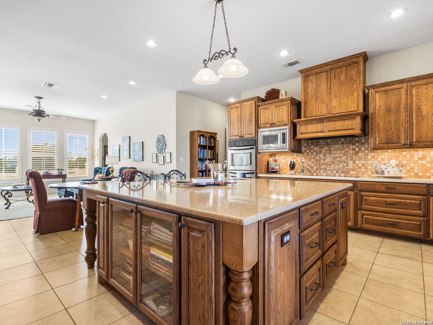 1000 Landmark Kerrville, TX 78028 - Photo 16 of 71 a kitchen with kitchen island granite countertop a sink counter top space appliances and cabinets
