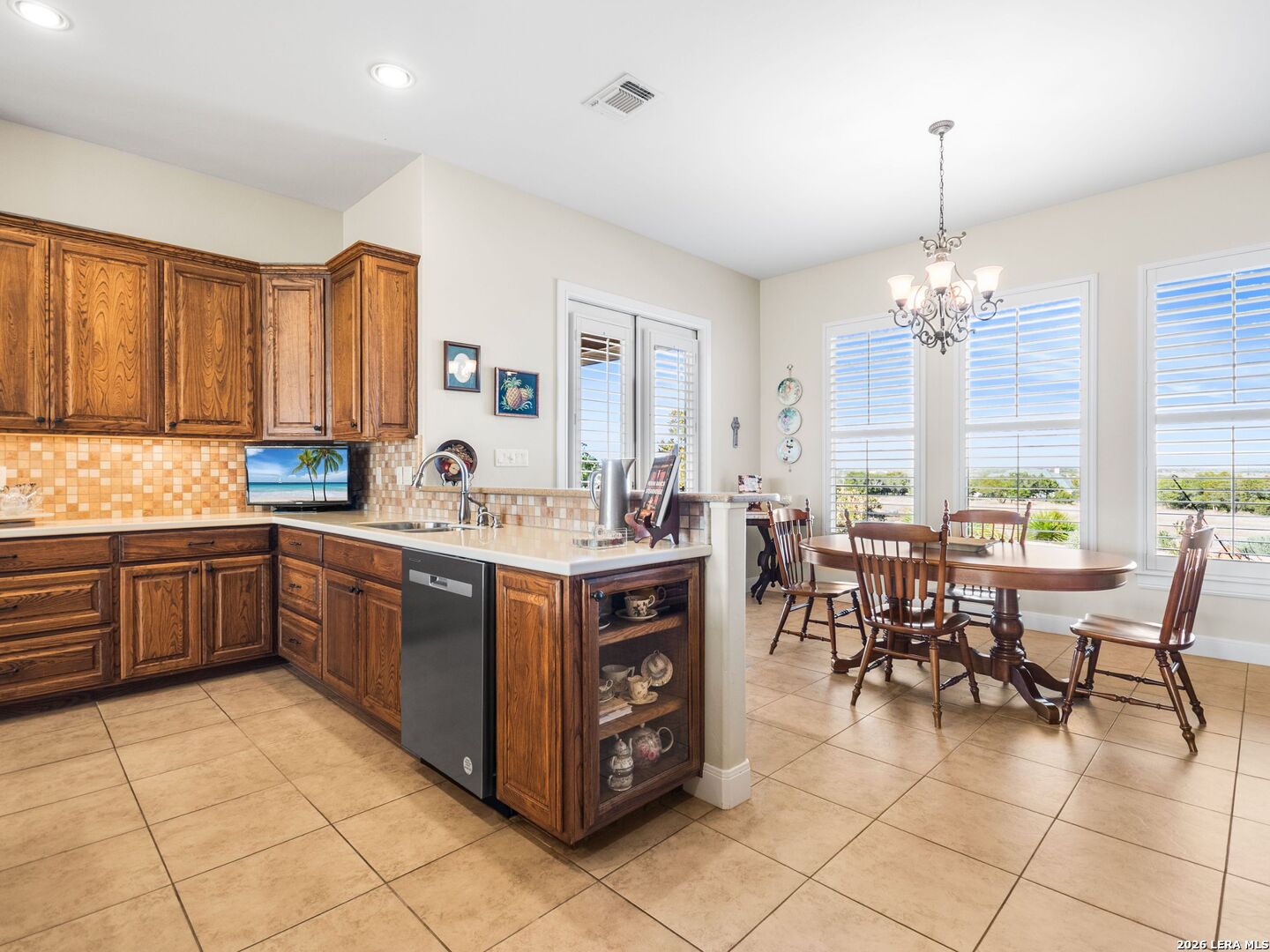 1000 Landmark Kerrville, TX 78028 - Photo 20 of 71 a kitchen with a large counter top space appliances and windows