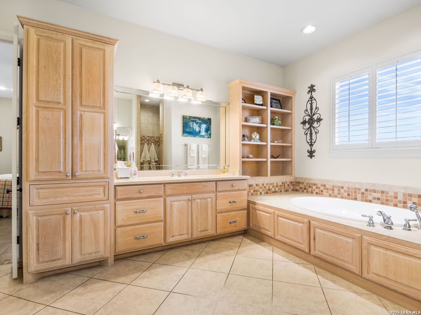 1000 Landmark Kerrville, TX 78028 - Photo 35 of 71 a spacious bathroom with a granite countertop sink a mirror and a bathtub
