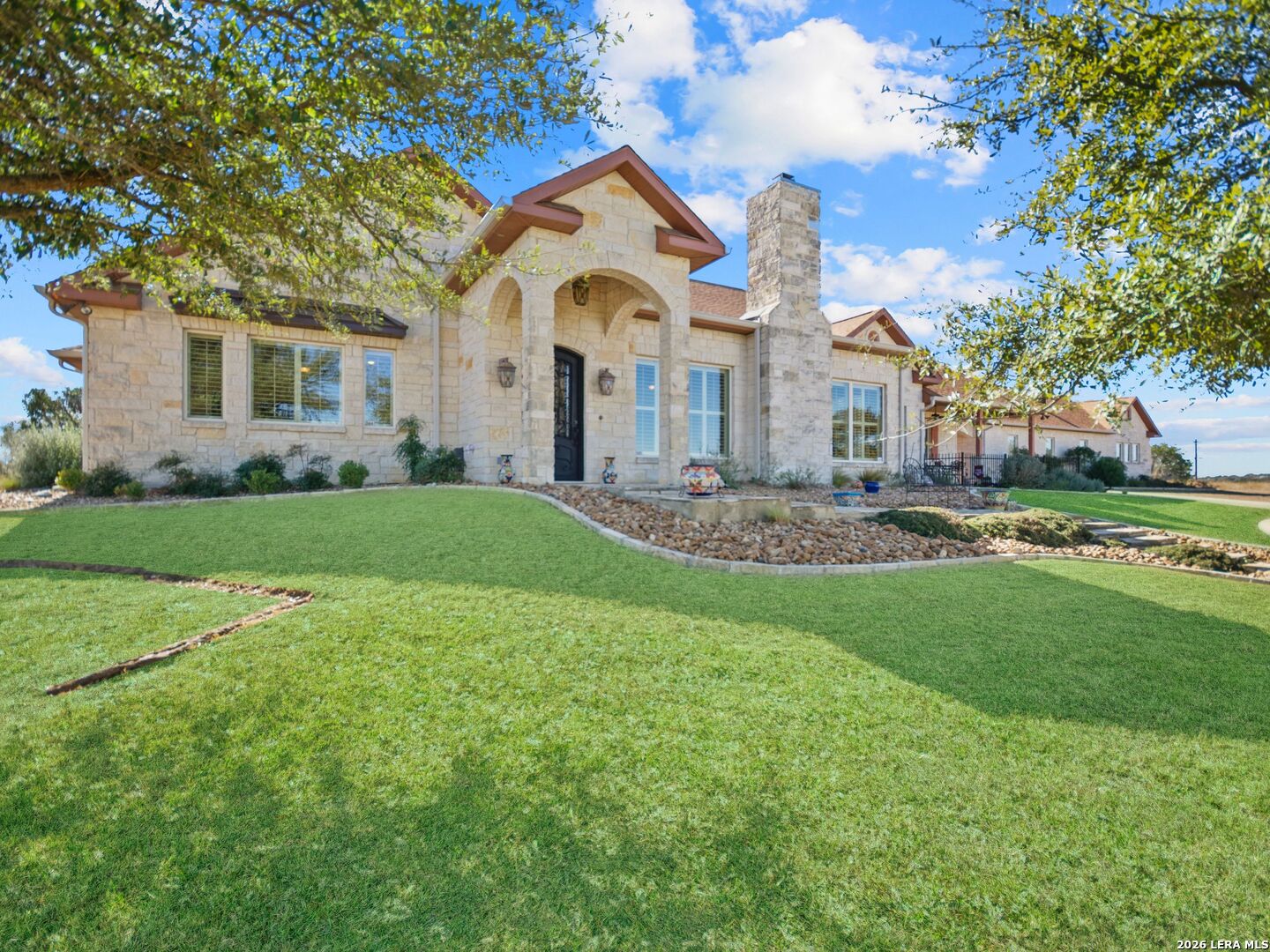 1000 Landmark Kerrville, TX 78028 - Photo 8 of 71 a front view of a house with a garden and yard