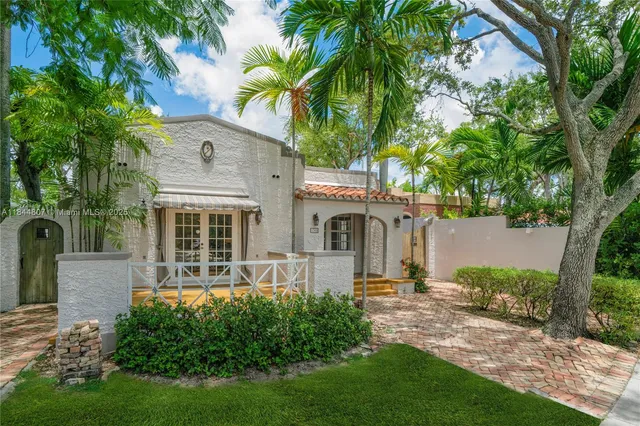a front view of a house with a yard and porch
