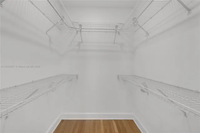 a bathroom with a bathtub sink vanity and toilet