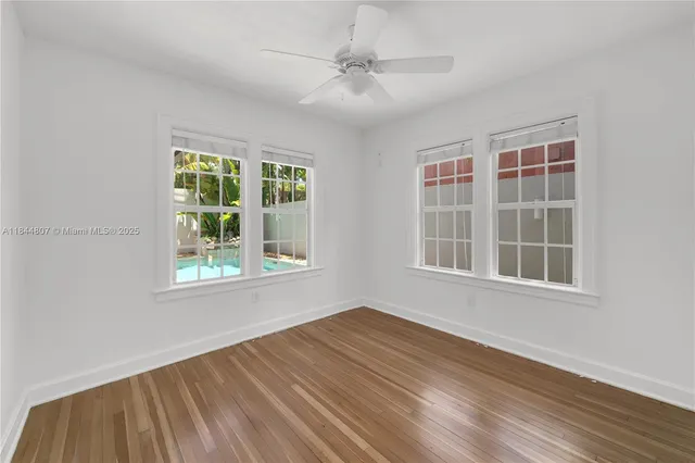 a spacious bedroom with a bed and a walk in closet