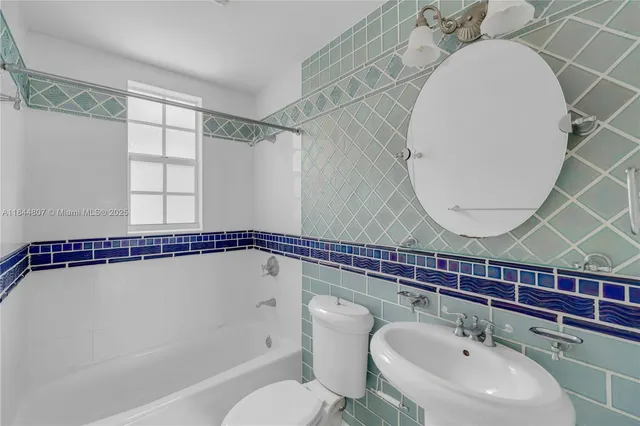 a hallway with washer and dryer