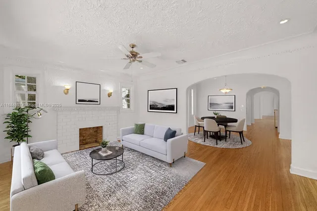 a living room with furniture and a fireplace