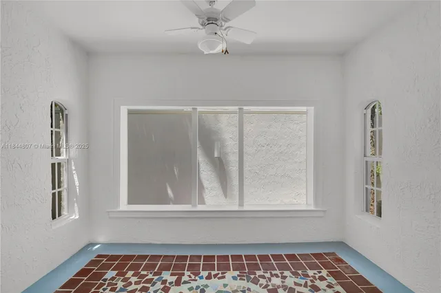 a kitchen with stainless steel appliances granite countertop a refrigerator and a stove