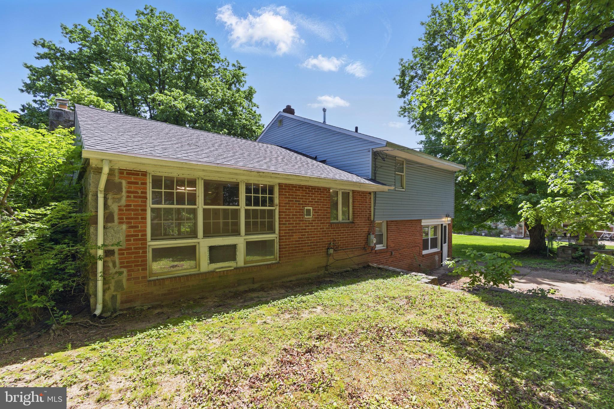 1208 June Road Huntingdon Valley, PA 19006 - Photo 36 of 36 a front view of a house with a yard and garage