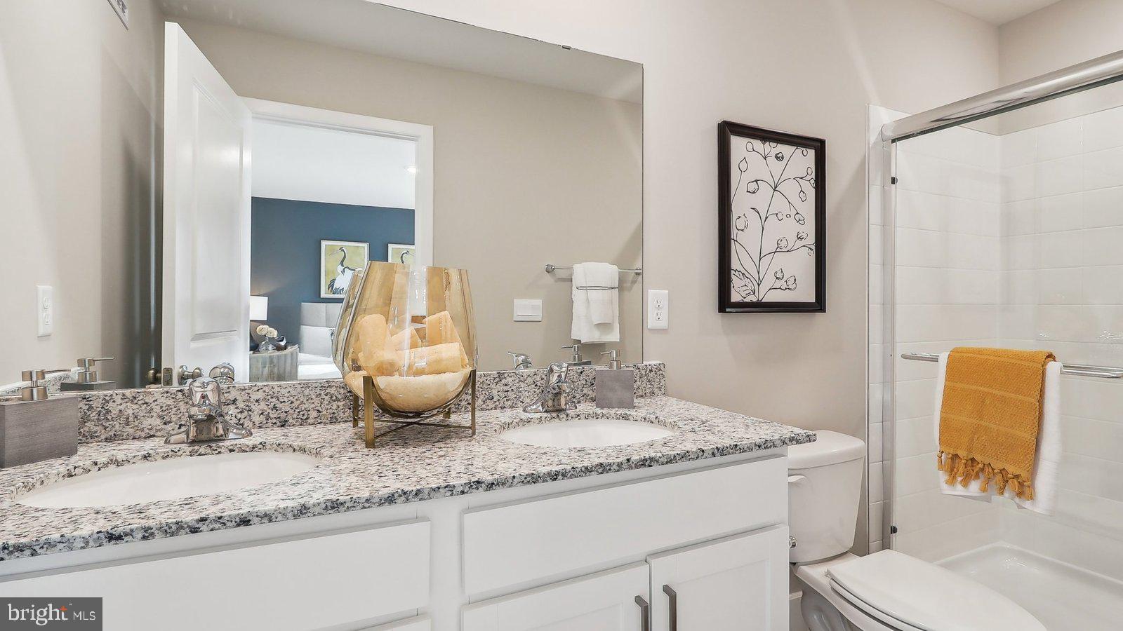 190 Sioux Loop Winchester, VA 22602 - Photo 27 of 44 a bathroom with a granite countertop sink and a mirror