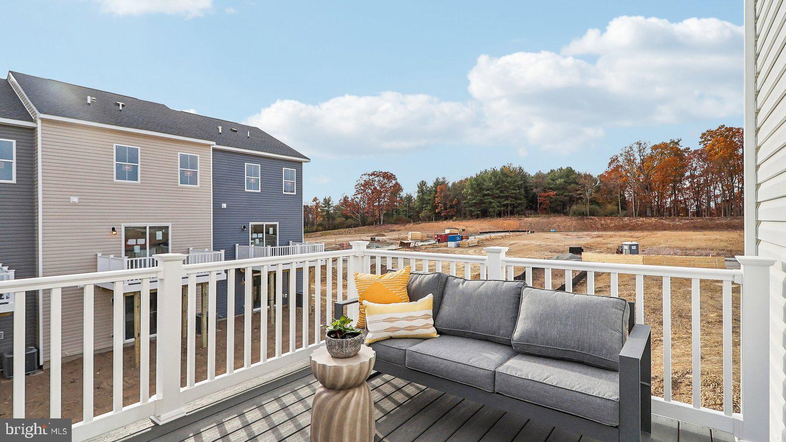 190 Sioux Loop Winchester, VA 22602 - Photo 42 of 44 a balcony of a house with wooden floor outdoor seating and barbeque oven