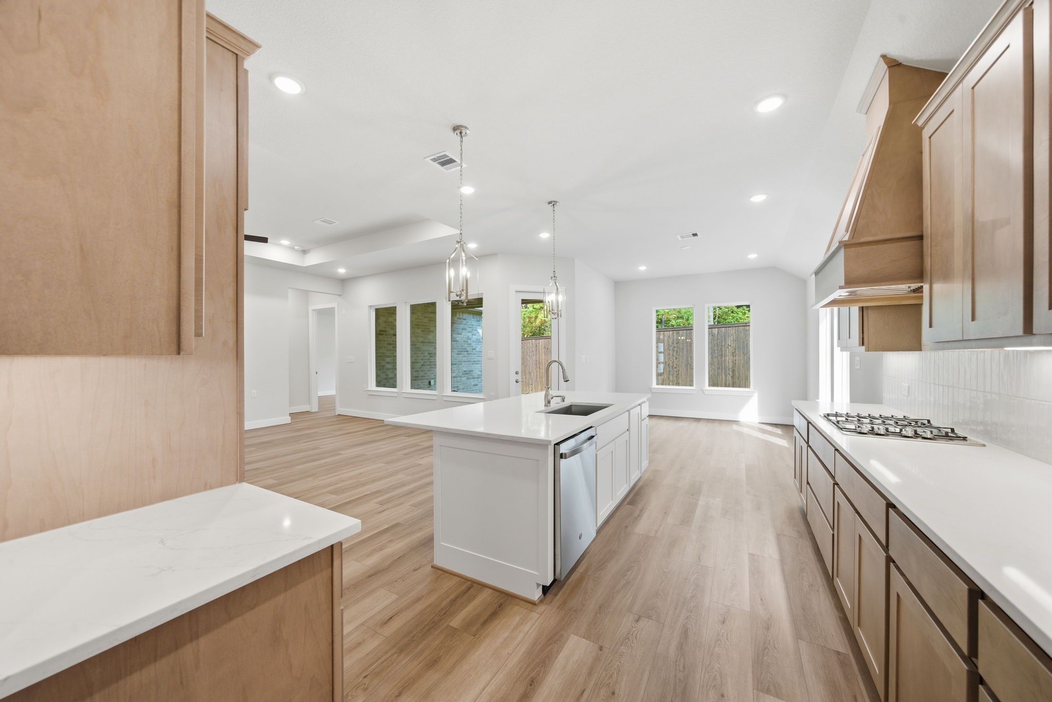 10026 Larkin Cove Willis, TX 77318 - Photo 12 of 46 a large white kitchen with a large window