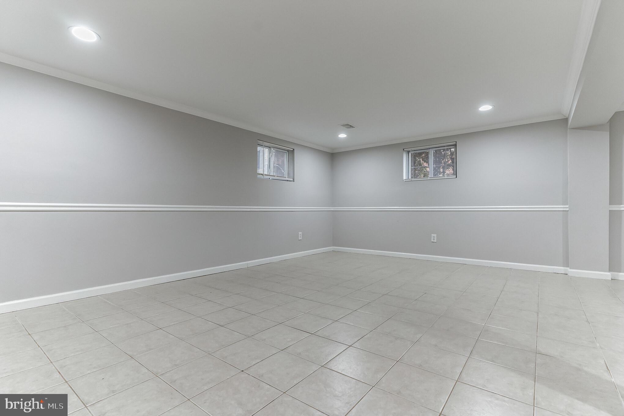 6414 Winnepeg Road Bethesda, MD 20817 - Photo 15 of 20 an empty room with white wall and windows