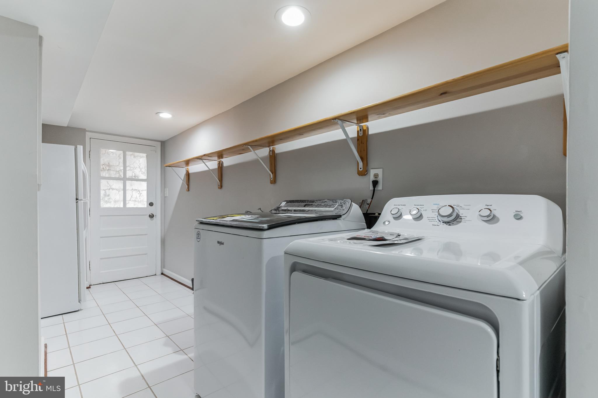 6414 Winnepeg Road Bethesda, MD 20817 - Photo 16 of 20 a utility room with dryer and washer
